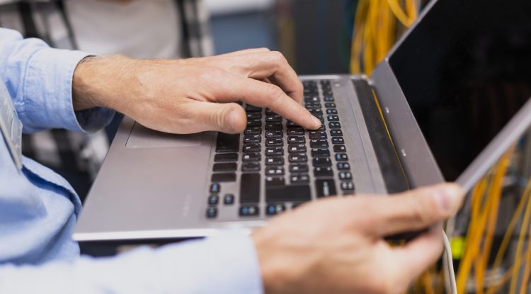 person-typing-laptop-close-up
